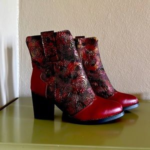 So unique! Red Leather boots with oil slick roses! 3in. Heel. Size 37.